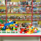 Plastic toy blocks on the white table in the store.