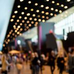 Blurred crowd of people in modern interior during event