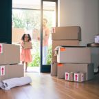 Gay couple, child and adoption moving in new home with boxes for property, investment or house toge.