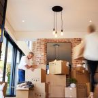 Shot of a mature couple unpacking boxes on moving day.